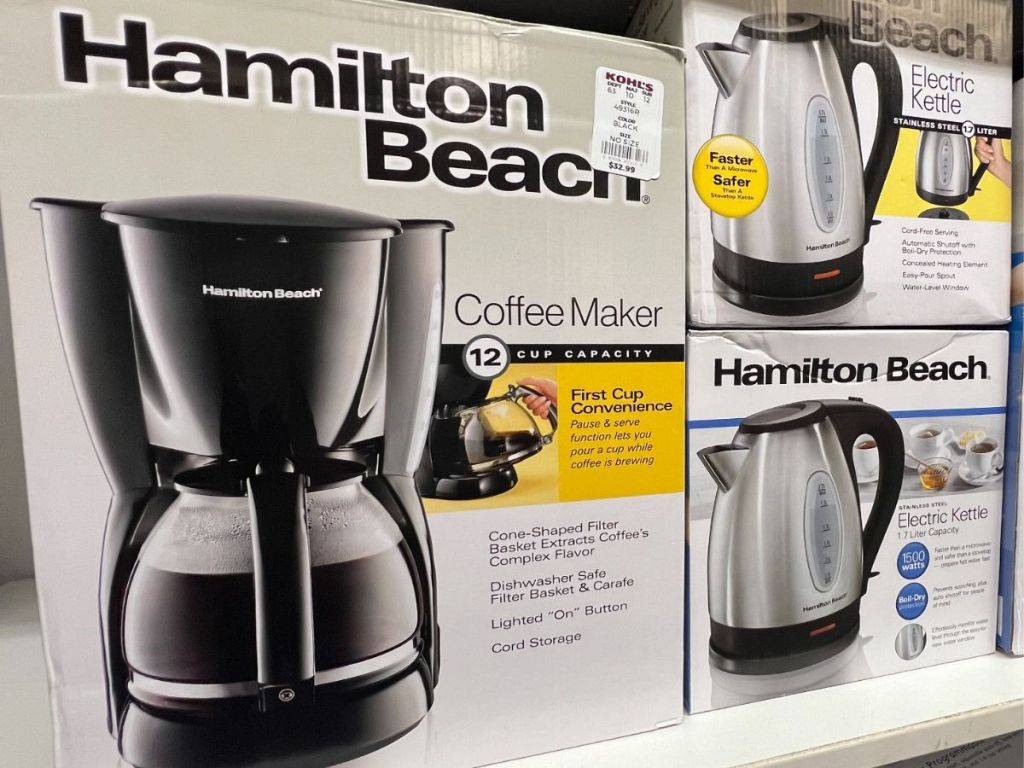 A coffee maker and two electric kettles in a box 