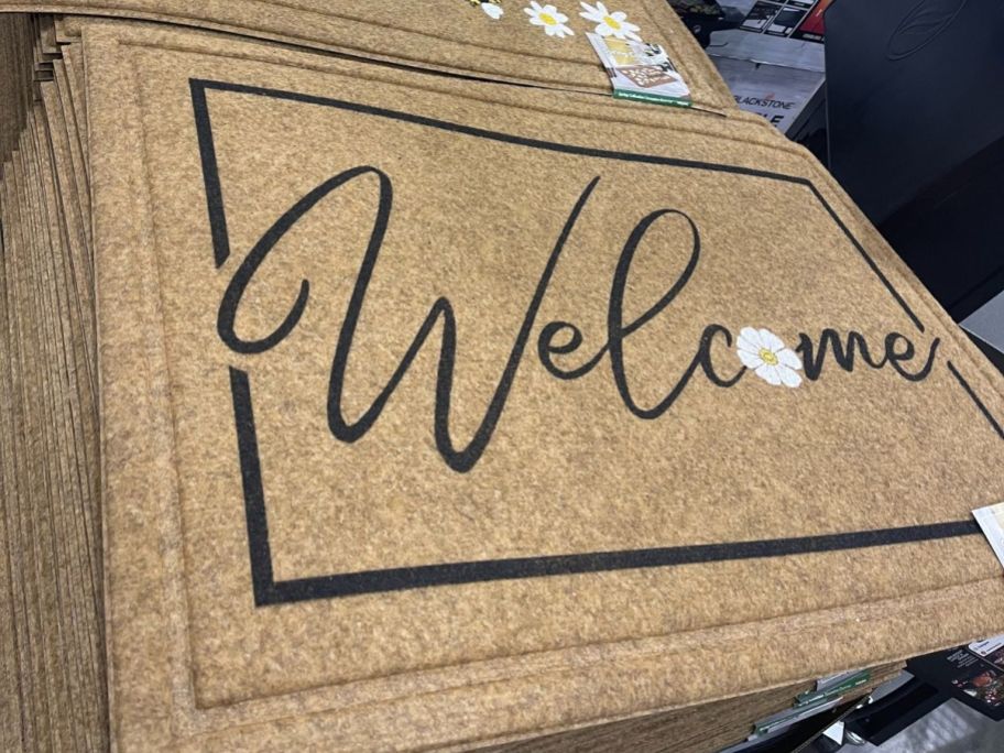 Costco Spring Mat with the word "Welcome" written on it