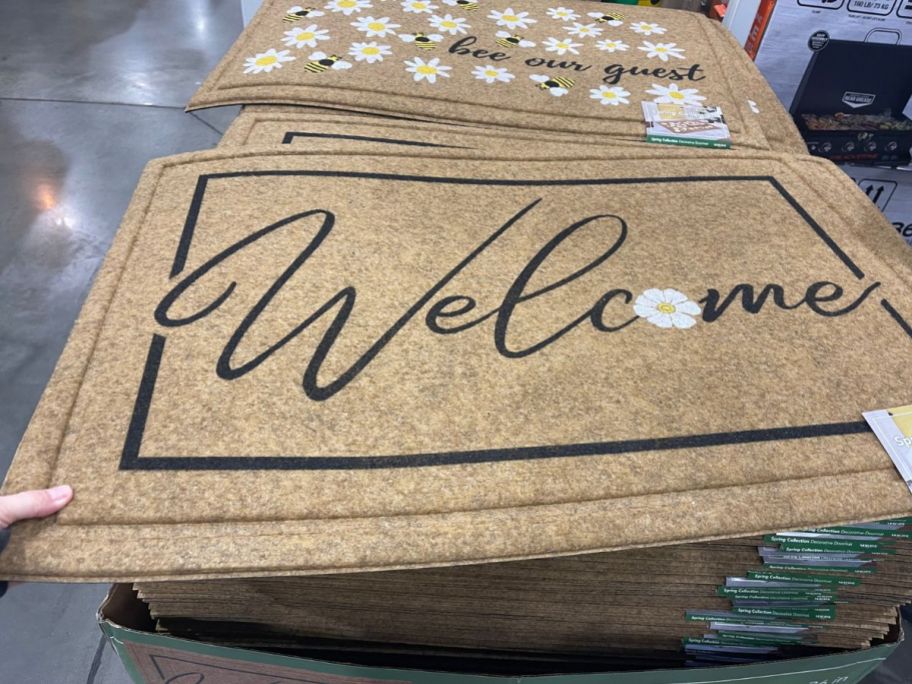 Costco Spring Mat with the word "Welcome" written on it