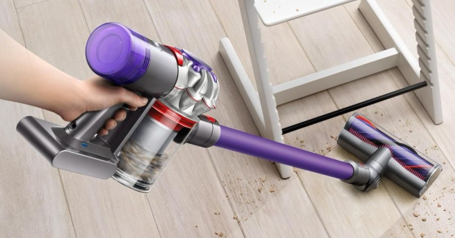 Dyson V8 Origin+ Cordless Stick Vacuum being used on a dirty floor