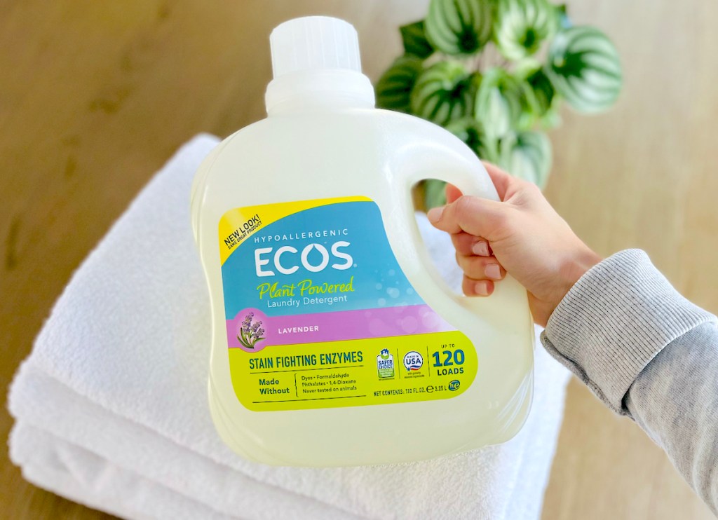 hand holding jug of ECOS liquid laundry detergent