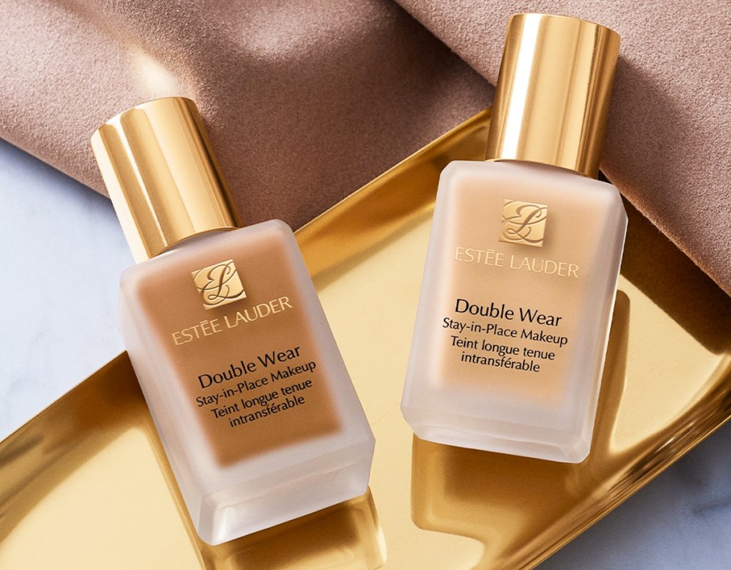 two bottles of Estee Lauder Double Wear Foundation on a gold tray