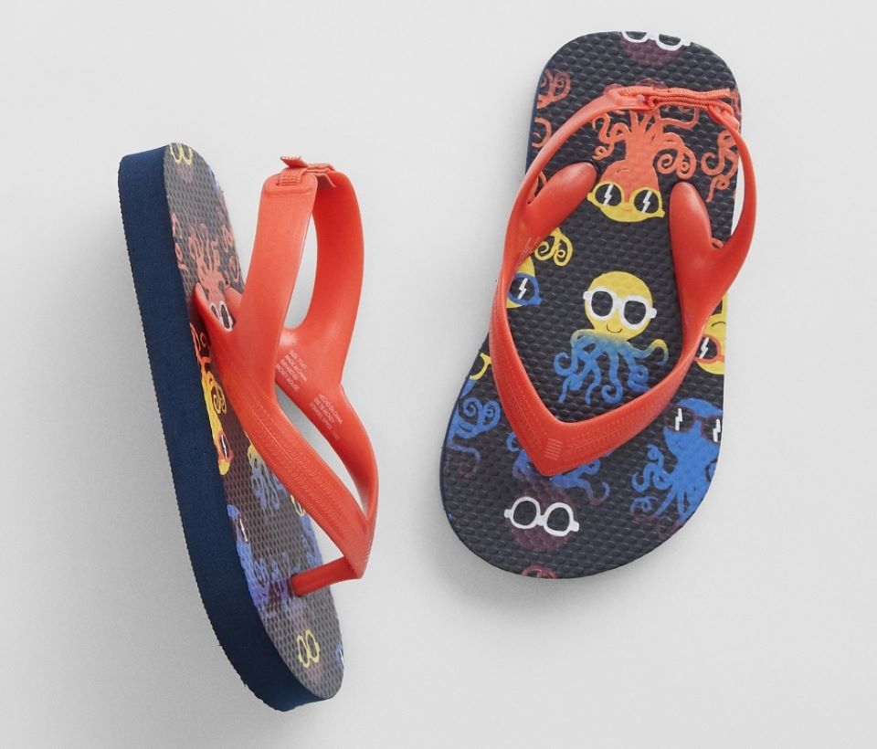 Pair of toddler flip flops with octupi on them