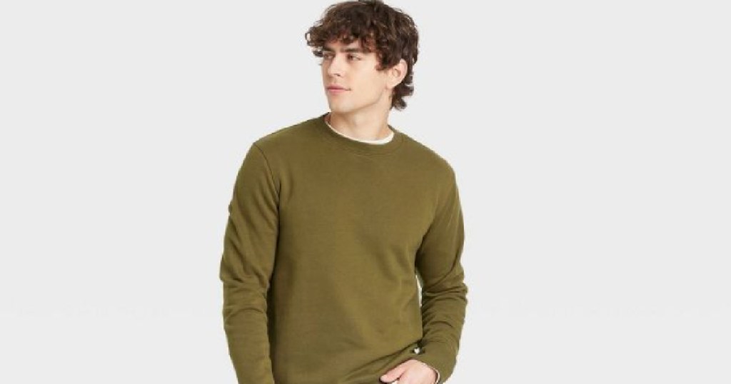 man in olive sweatshirt 