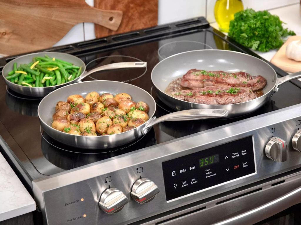 3 stainless steel pans on stove