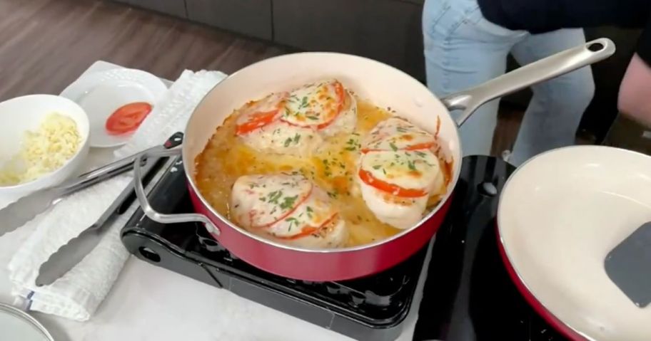 A Greenpan sauce pan with chicken in it