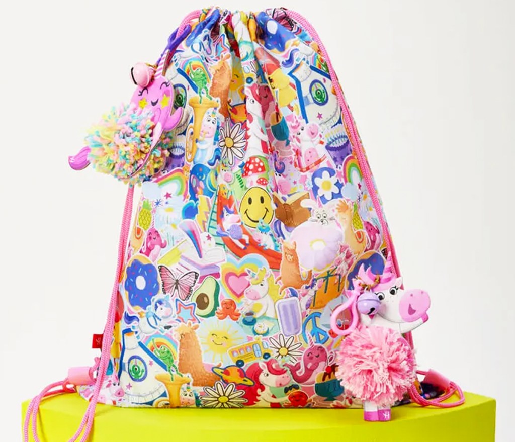 pompom keychains on sling backpack