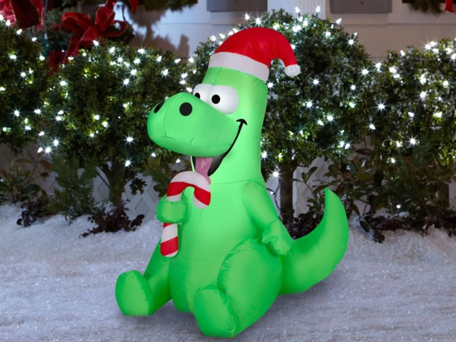 Holiday Living 3.5' LED Dinosaur Christmas Inflatable in front of house