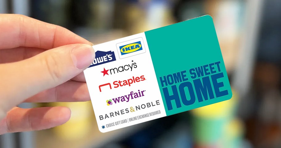 hand holding up a home sweet home gift card