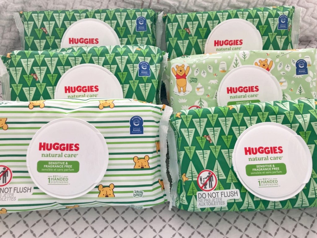 6 green packages of huggies baby wipes