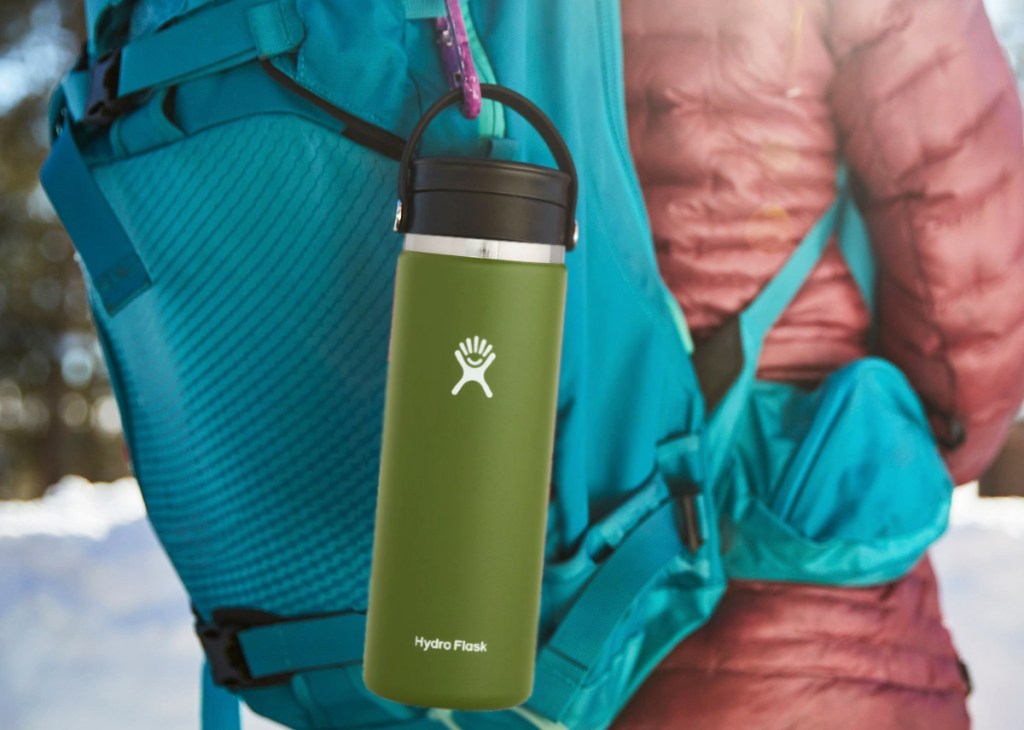 hydro flask clipped onto backpack