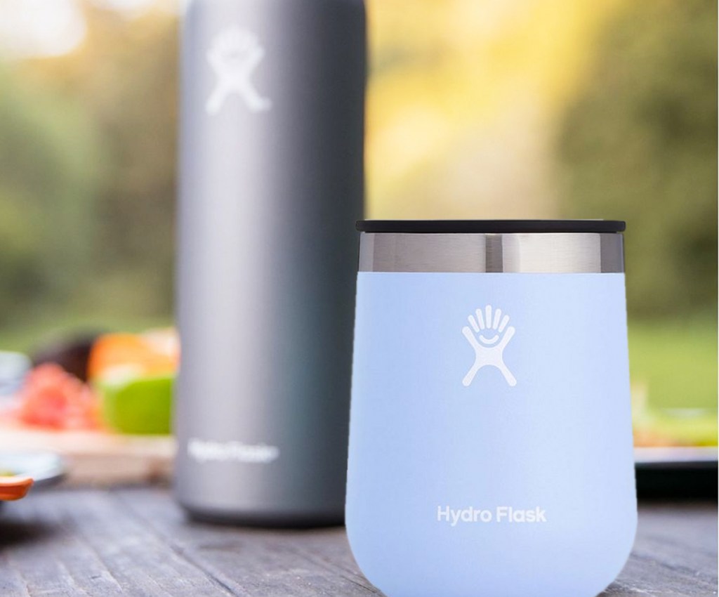 hydro flask wine tumbler and bottle on table