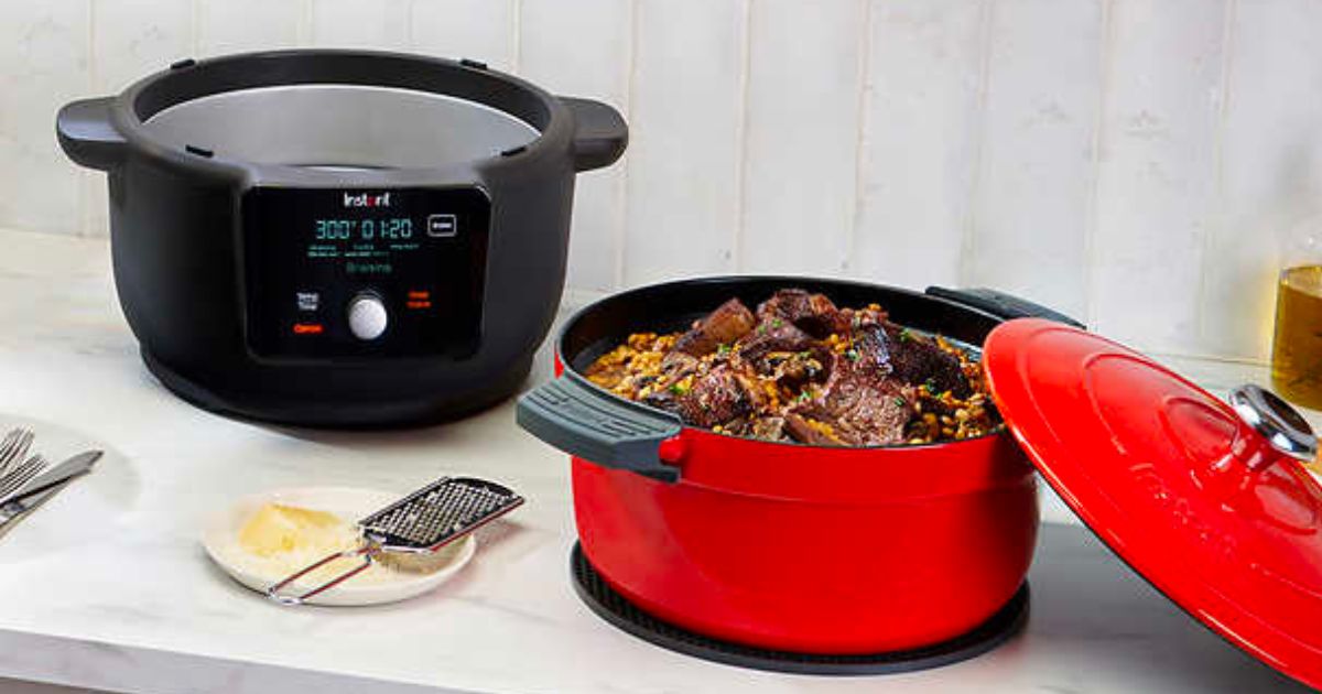 Instant Pot red 6qt dutch oven on a kitchen counter with a cooked pot roast in it
