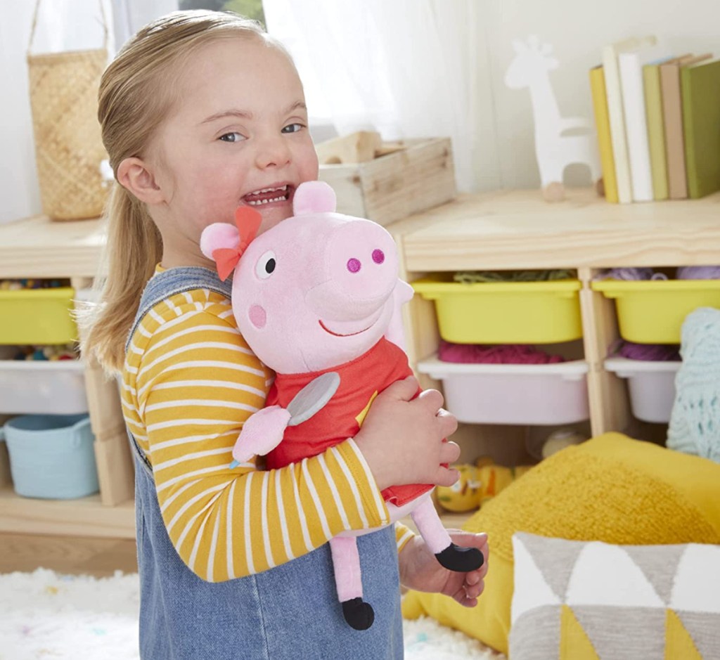 Kid holding Peppa Pig Plush