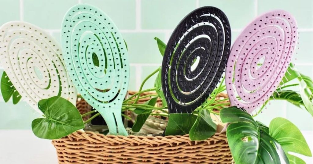 4 Knot Genie Biodegradable Hair Brushes in a basket