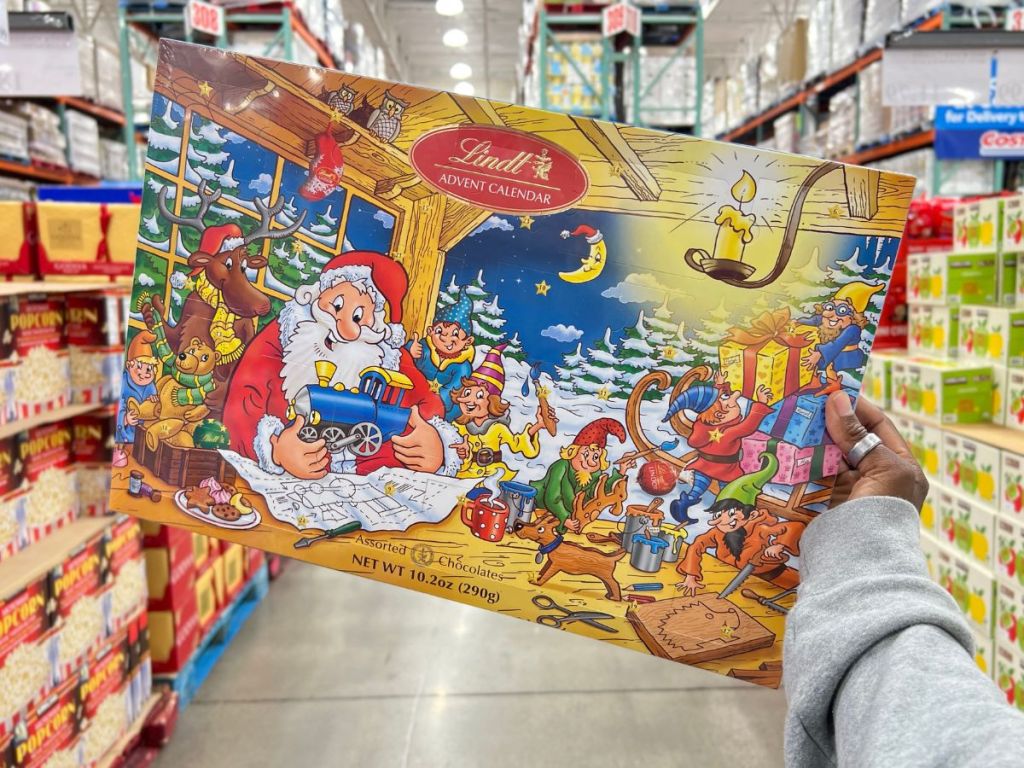 A hand holding Lindt Advent Calendar in store