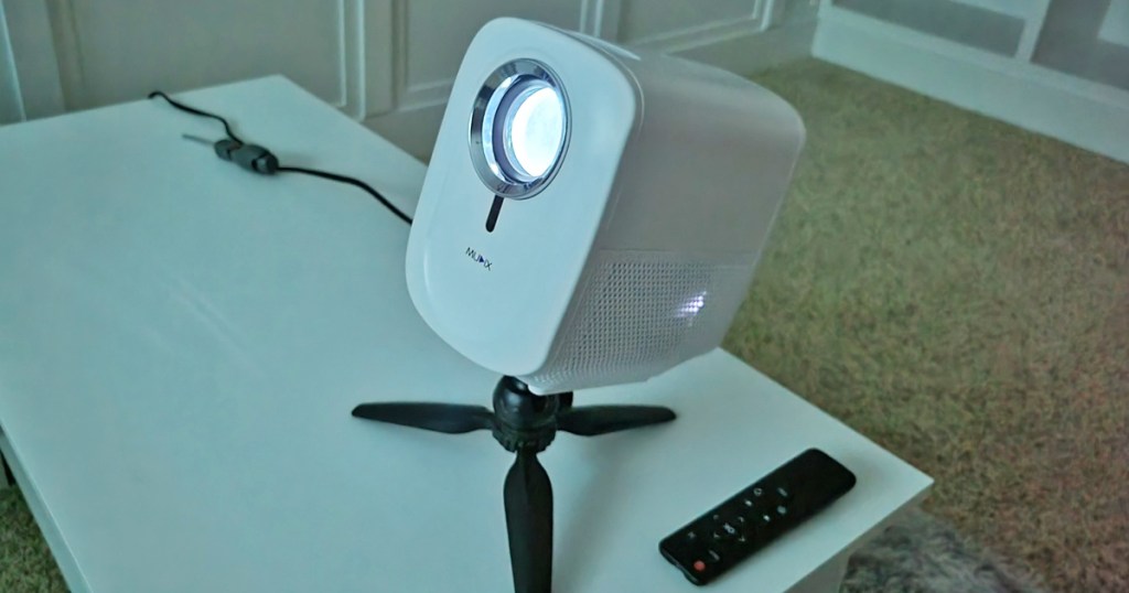 mini movie projector on tripod