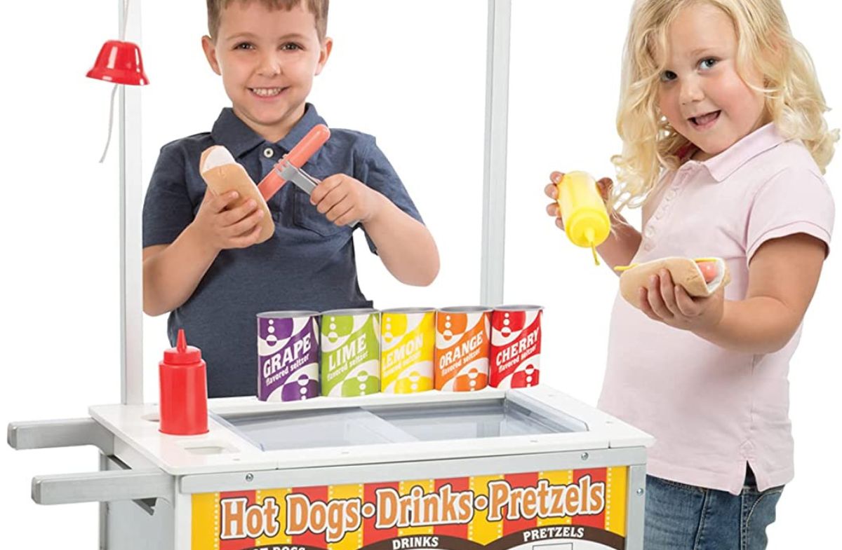 kids playing with an hotdog cart playset