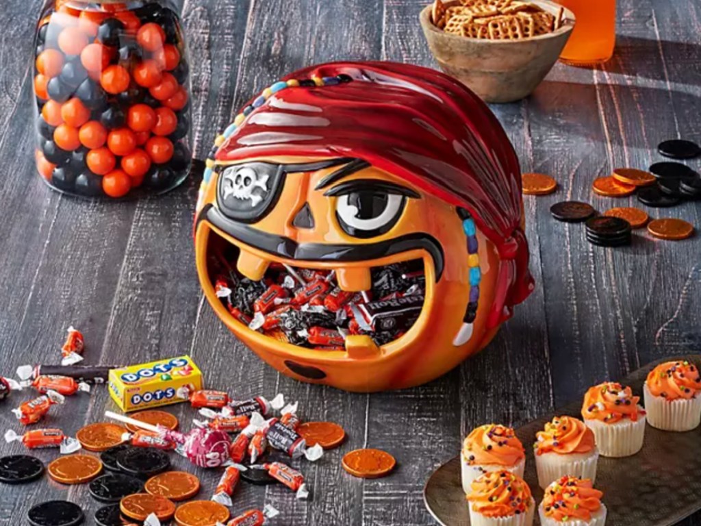 ceramic halloween pumpkin bowl filled with candy and pirate themed