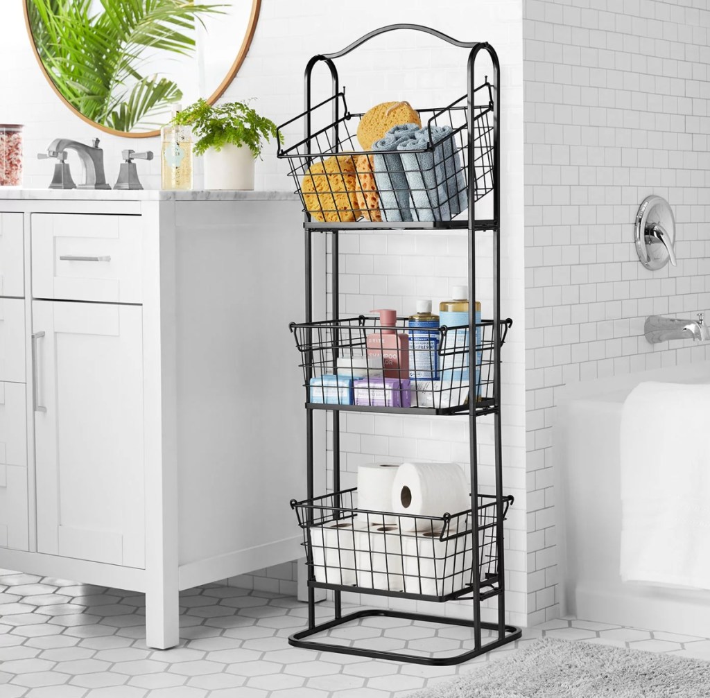 Bathroom with a three tier wire basket holding bathroom supplies