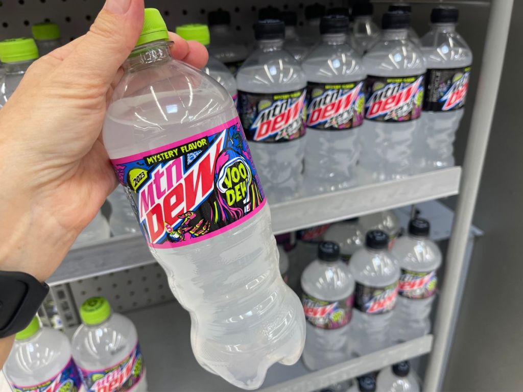 A hand holding Mtn Dew Mystery Flavor Bottle