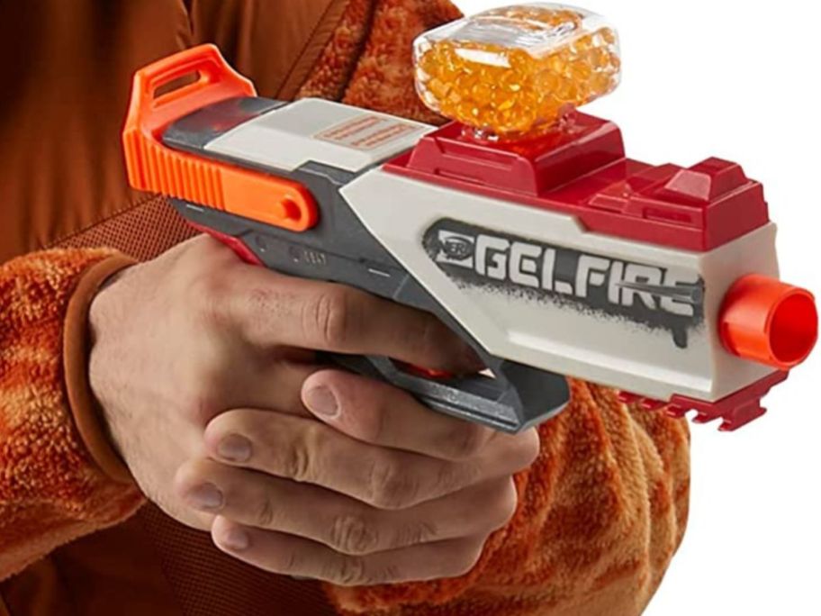 hands holding white and red Nerf Gelfire Blaster