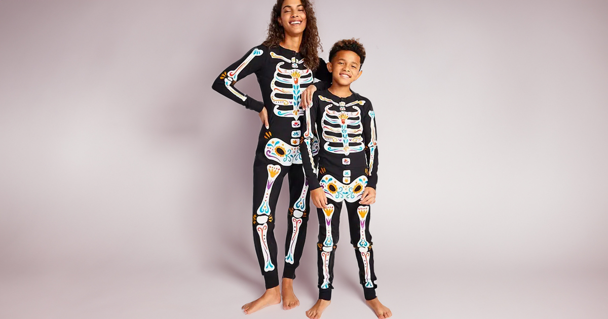 girl and boy wearing skeleton pjs