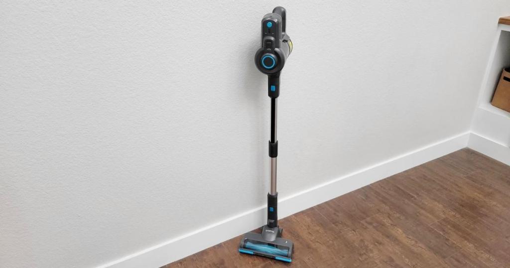 oraimo stick vacuum free standing near wall