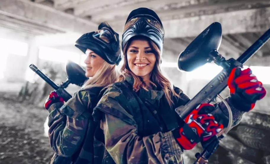 two girls playing paintball