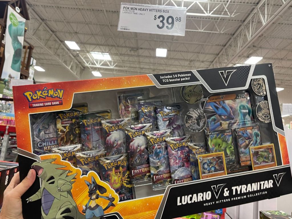 hand holding up Pokémon Heavy Hitters Premium Collection in store