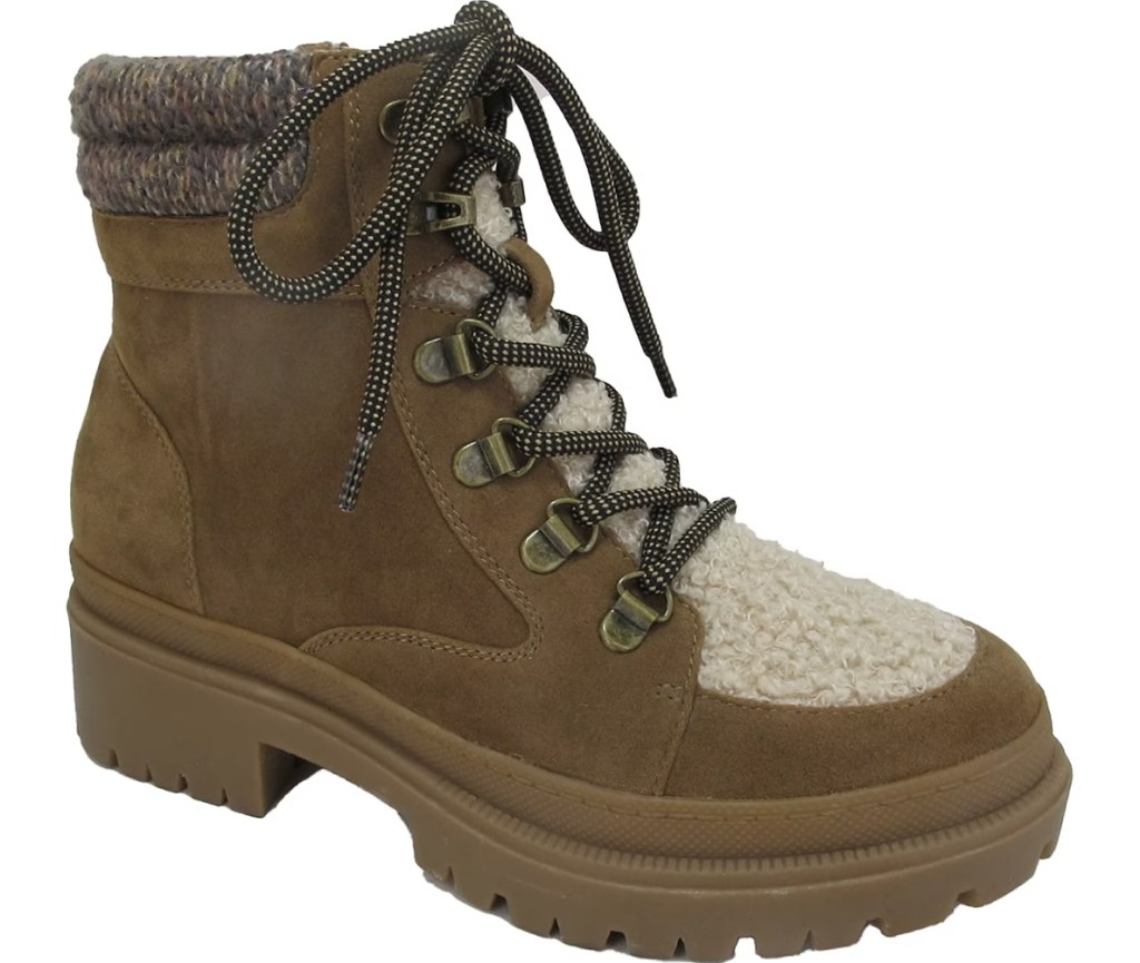 Brown lace-up women's boot with a white lining on the outside of the tongue