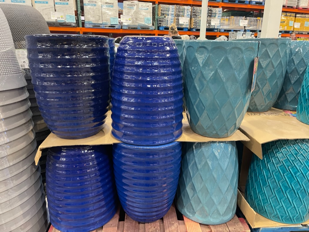 Blue decorative planters on a costco store shelf