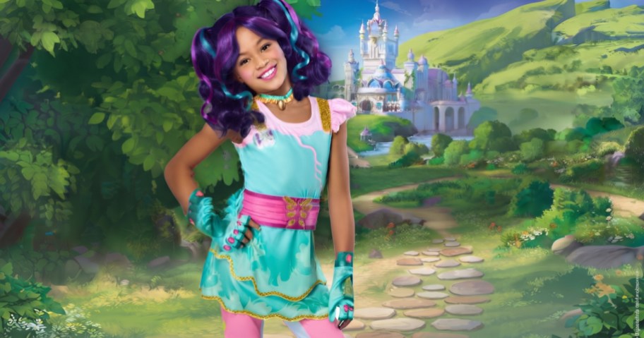 A girl wearing a turquoise and pink Unicorn Academy costume with purple hair, posed against a fantasy castle and garden backdrop.