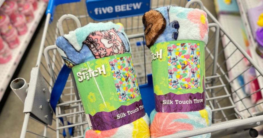 2 Stitch Silky Touch Throws in the basket of a Five Below Cart