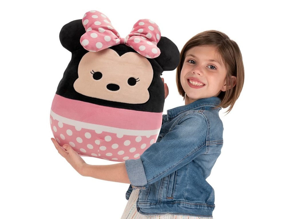 girl holding Minnie Mouse Squishmallow