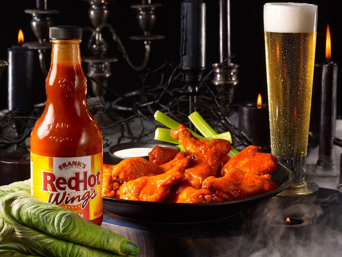 Franks Rd Hot Wings sauce bext to plate of wings