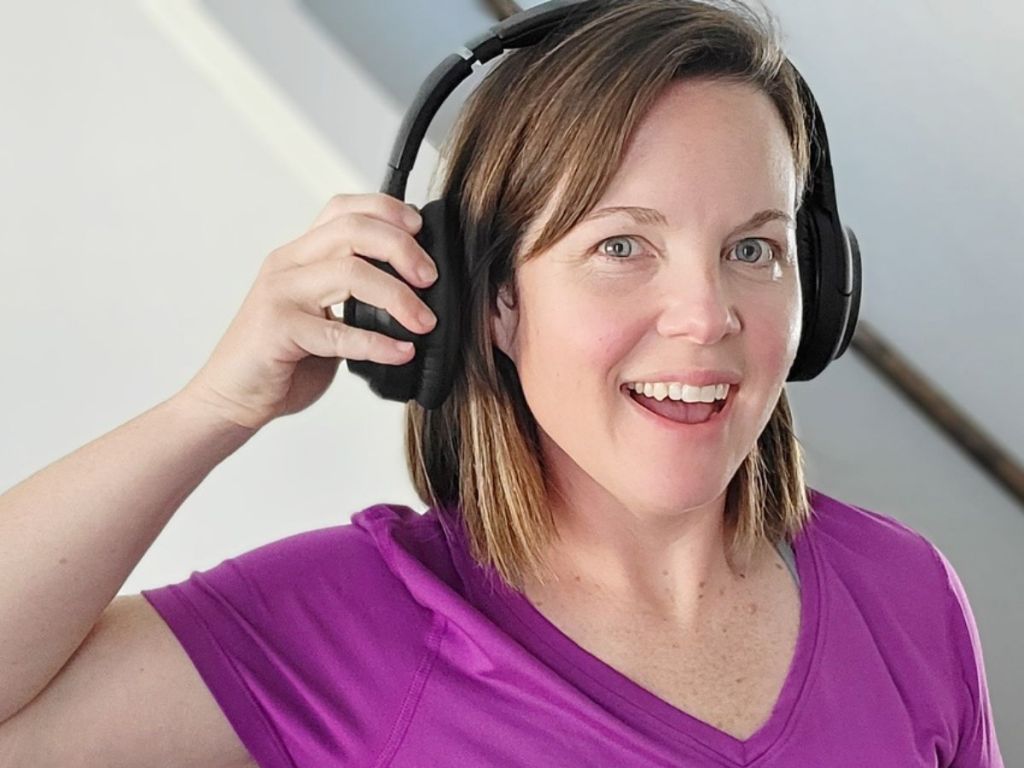woman wearing Taotronics headphones