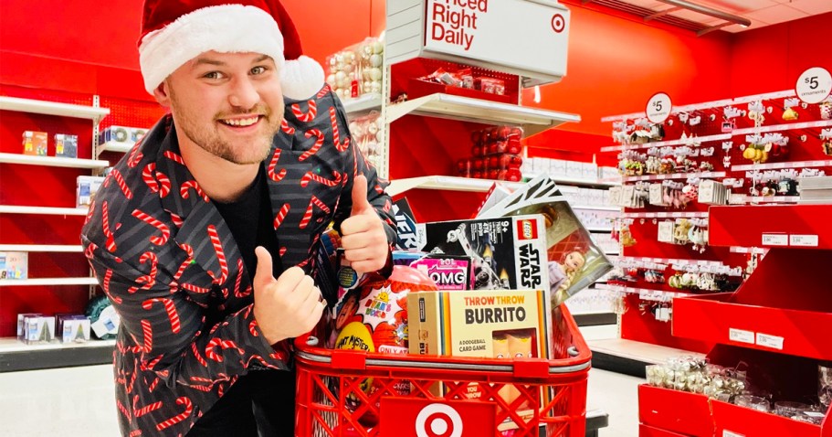 man giving thumbs up next to target cart