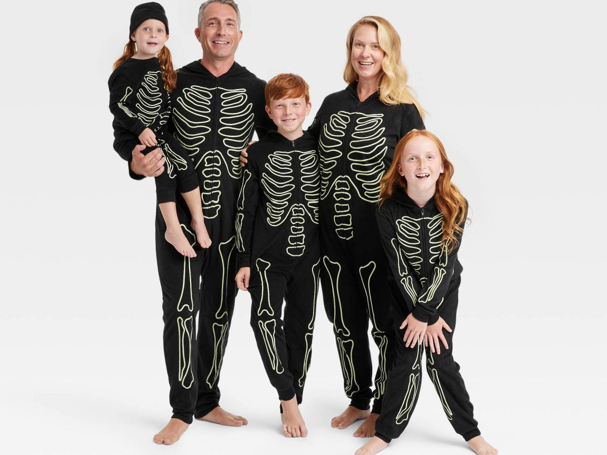 family wearing matching halloween pajamas