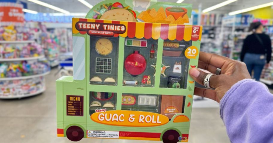hand holding a Teeny Tinies mini food play set in packaging that looks like a Taco Truck