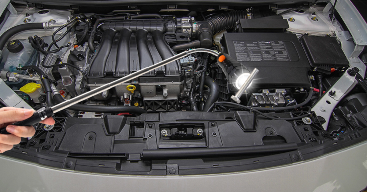 Telescoping LED Magnetic Pickup Tool used with car maintenance