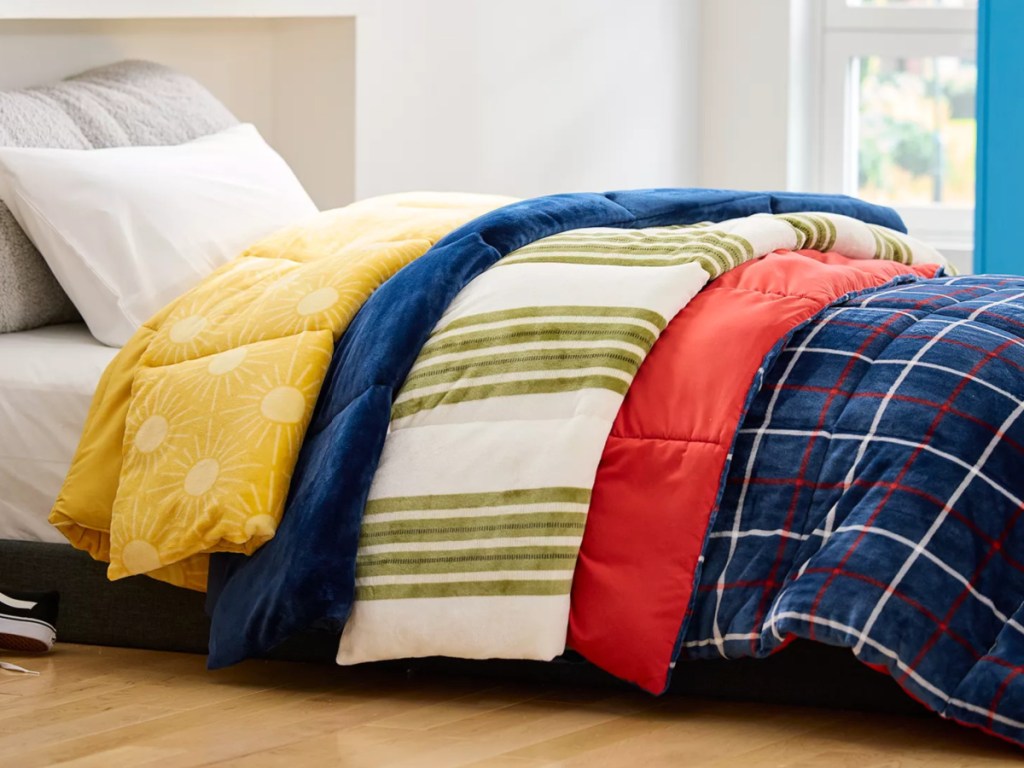 multiple comforters on a bed
