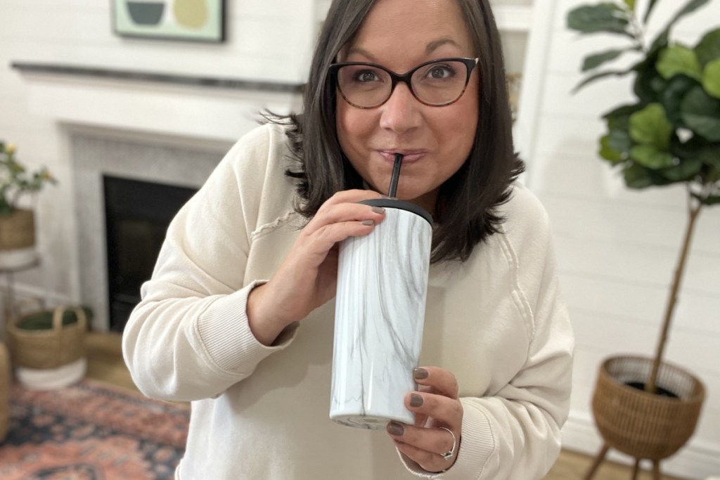 Woman drinking from a Simple Modern Tumbler