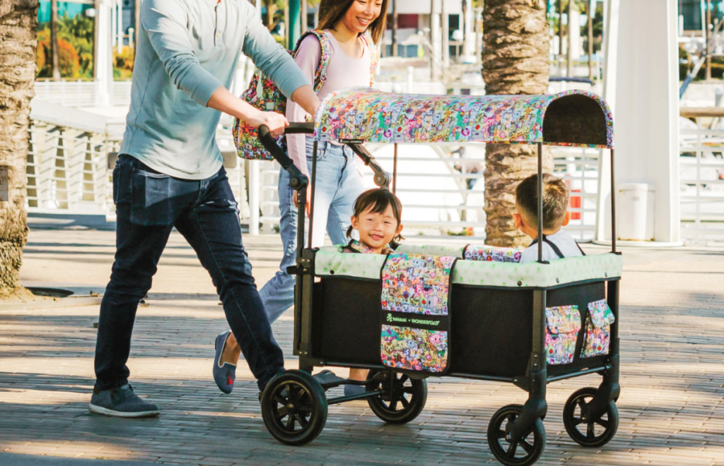 A family using the a Wonderfold Wagon Tokidoki Stroller