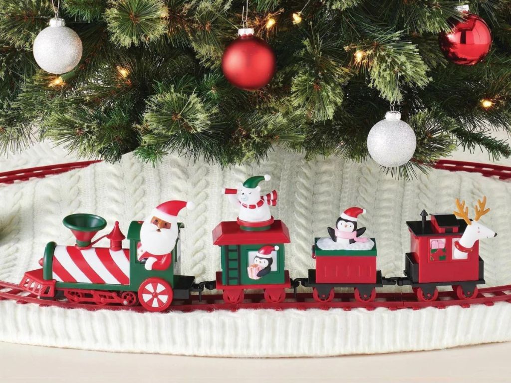 A Christmas train set under a tree