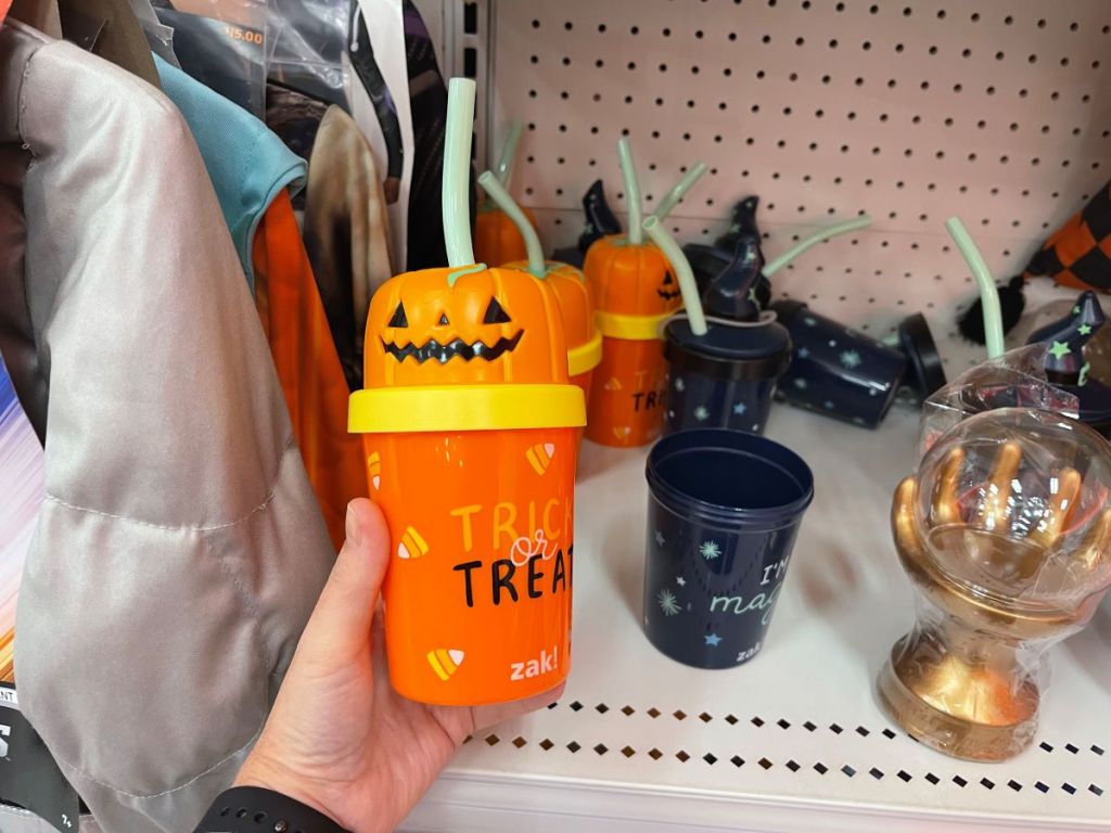 hand holding a Halloween cup
