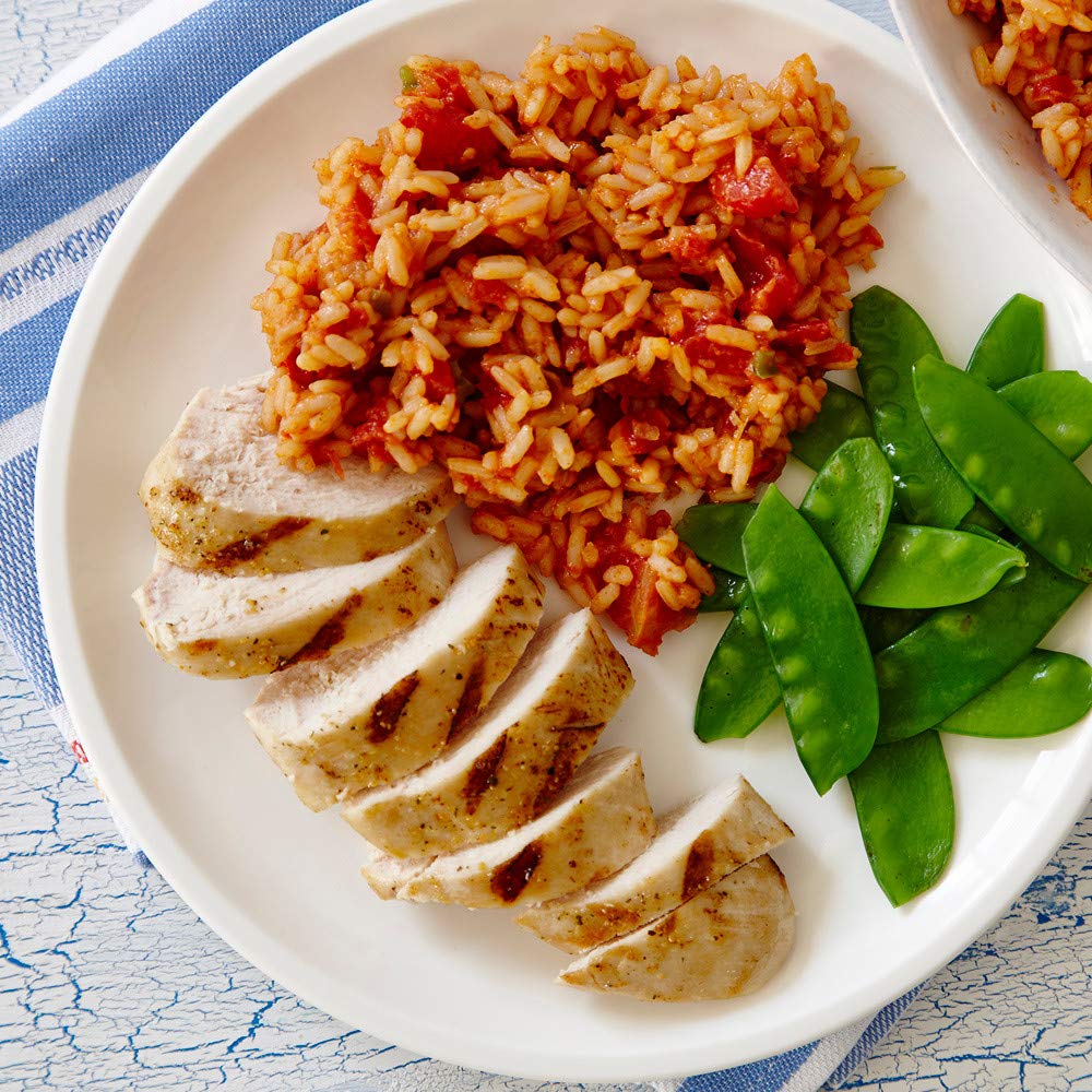 Zatarains Spanish rice on a plate with grilled chicken