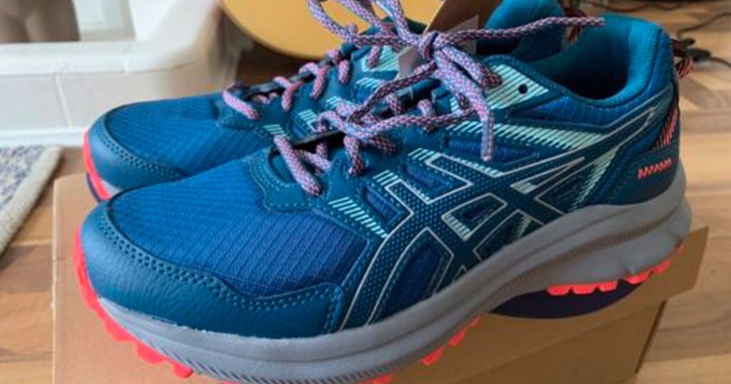 a pair of asics running shoes