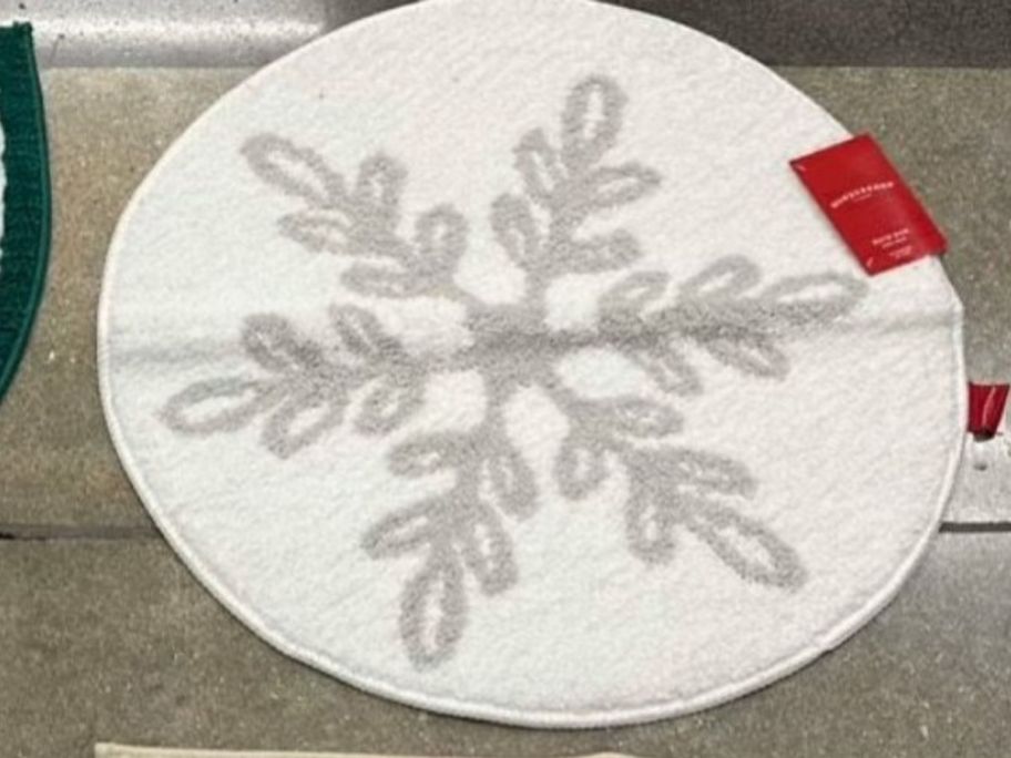 Snowflake Christmas Bath Rug on floor in store