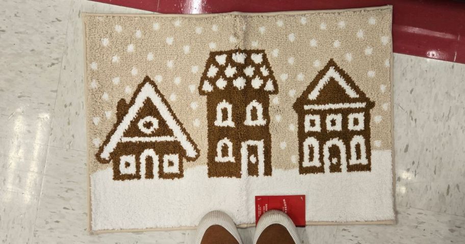 Gingerbread house Christmas bath rug on the store floor